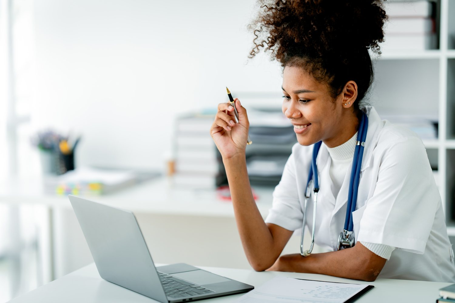 Doctor completing records and paperwork